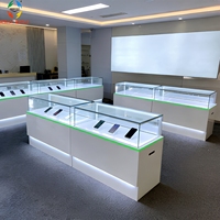 Vitrine de kiosque téléphonique minimaliste moderne pour centre commercial, avec éclairage LED, dos en verre, en aluminium, écologique, personnalisable, pour conception complète de magasin