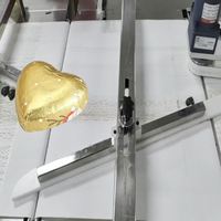 Machine d'emballage de chocolat en forme de cœur avec film métallisé, haute efficacité, thermoscellage entièrement automatique, personnalisable