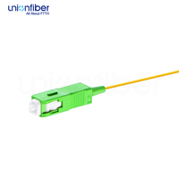 Fiber Optik Pigtail Simplex OS2 Single Mode G652D 0.9mm LSZH SC APC 1M dengan Buffer Ketat untuk FTTH, Pusat Data, POE, dan 5G