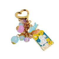 Joli porte-clés vintage en alliage de zinc avec papillon de dessin animé et fausse perle en relief, ornement de sac à la mode pour femme, breloque de voiture