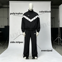 Ensemble de survêtement personnalisé pour homme en nylon, coupe oversize, avec broderie, veste coupe-vent résistante à l'eau à blocs de couleur et pantalon large à jambes larges