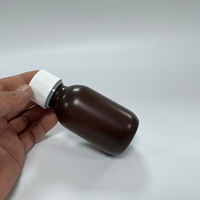 Bouteilles de sirop contre la toux et de médicaments liquides en plastique HDPE couleur chocolat, 1 oz et 2 oz, avec bouchon à vis, personnalisées en usine au Vietnam