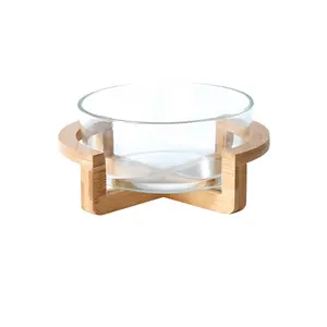 glass salad bowl with wooden stand and server