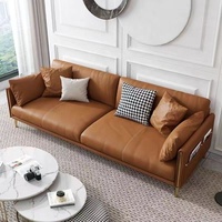 Sofa-Set mit Cognacfarbenem Vollnarbenleder, Zeitschriftenfächern, Schlanker Metallbeinen, Ottoman und Sessel für Wohnzimmer, Großhandel, Genäht