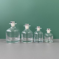 Diffuseur de roseau en verre de luxe avec logo personnalisé bouteille 100ml 150ml 250ml diffuseur rond vide transparent avec bâton et couvercle