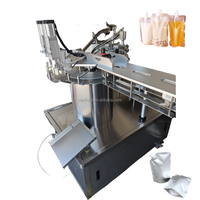 Machine de remplissage automatique de sachets à bec verseur Doypack liquide pour pâte de miel, pâte de tomate, crème, jus de lait, machine de remplissage et de capsulage