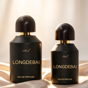 Botella de perfume de vidrio mate negro de lujo de Factory Outlet, vacía, de 30ml, 50ml, 100ml, cilíndrica, con tapa de madera oscura en forma de cúpula. - Product Image 1