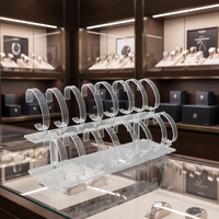 Support de présentation à deux niveaux en acrylique transparent pour montres et bracelets, conçu pour les comptoirs de vente au détail et l'organisation de bijoux