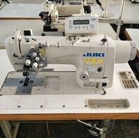 Machine à coudre industrielle d'occasion Juki LH-3568A-7 à double aiguille, plate, semi-sèche, avec coupe-fil automatique