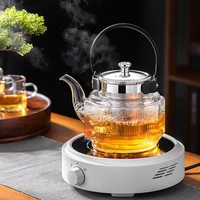 Théière en verre transparent à haute teneur en borosilicate de style classique stockée à la main, sûre pour la cuisinière avec infuseur, bouilloire à thé d'une capacité de 600ml