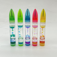 Stylo bille en gros en forme de balle avec minuterie liquide, points colorés à effet de goutte d'huile, jouet anti-stress relaxant, décoration de bureau, boîte PDQ personnalisée