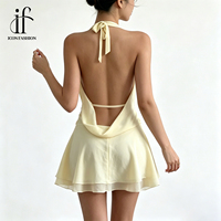Robe d'été personnalisée en gros pour femme, noire unie en viscose, col licou, décolleté plongeant en V, sans manches, ourlet à volants, mini-robe