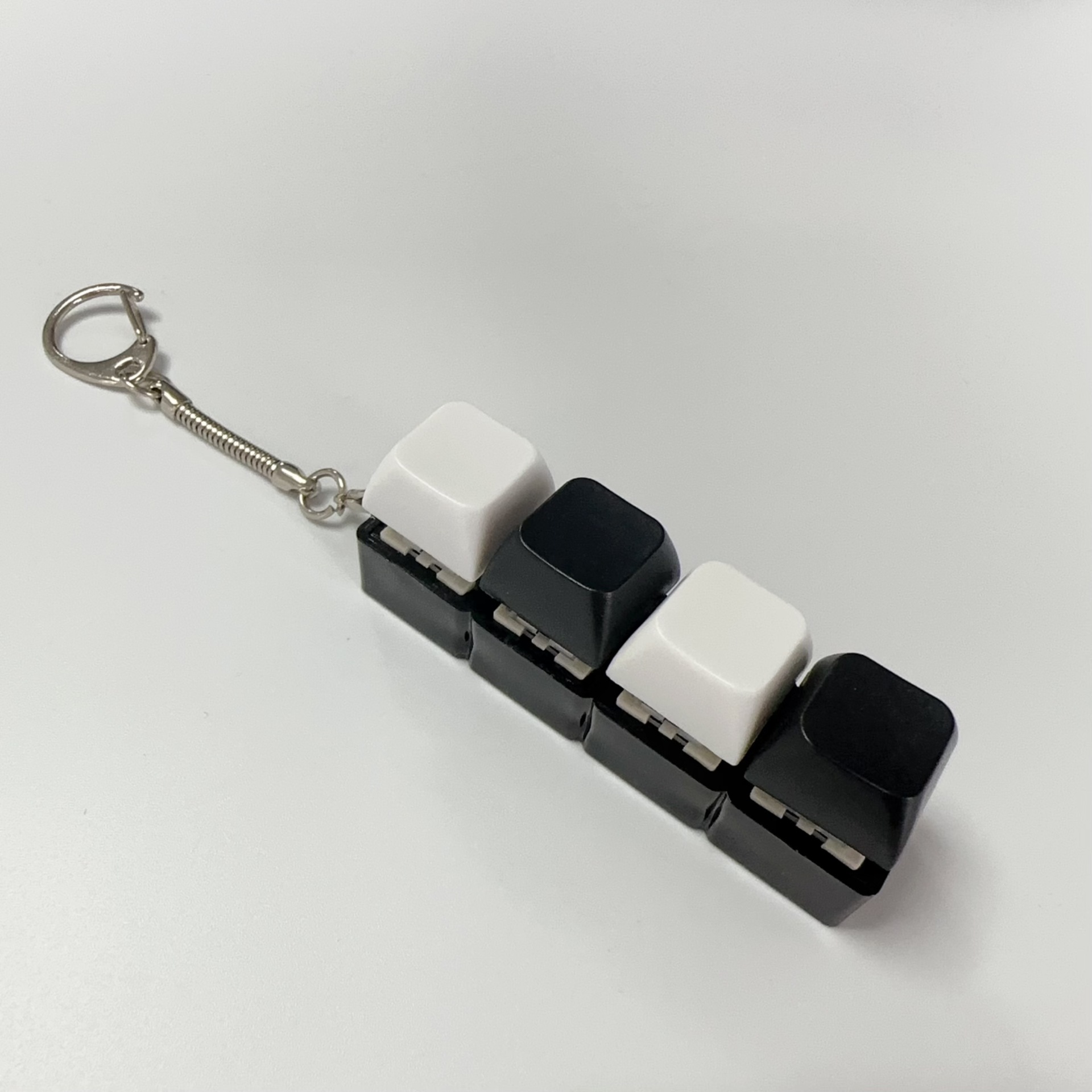 Four key black shell-white black