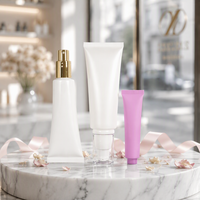 Tube cosmétique rond blanc vide avec bouchon pompe doré/argenté pour lotion/sérum visage/yeux, emballage personnalisé avec logo sérigraphié