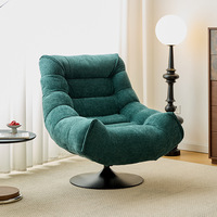 Fauteuil de salon pivotant de style italien, design nordique minimaliste et luxueux, pour la maison, le salon ou le balcon, avec pouf intégré.