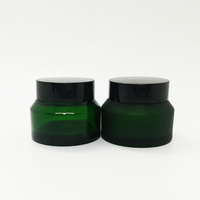 ODM 15ml 30ml 50ml 100ml Pot en verre vide de couleur verte Pot en verre de crème cosmétique Pot en verre d'épaule en pente Pot avec couvercle à vis Fabrication