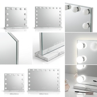 Miroir de maquillage rectangulaire éclairé avec bordure à ampoules et cadre blanc