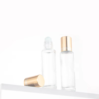 Flacon à rouleau en verre transparent de 15ml avec couvercle en or et rouleau en acier pour bouteille en verre à bille de parfum d'huile essentielle