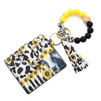 Vente chaude Bien Nouveaux Designs Tendance De La Mode Léopard Vache Motif Silicone Perles Bracelet Porte-clés Bracelet Avec Portefeuille En Cuir