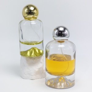 Bouteilles de parfum en verre cylindriques OEM/ODM de 30 ml, 50 ml, 100 ml avec fond doré, argenté, bleu, rouge, vert pour cadeaux et parfums - Product Image 5