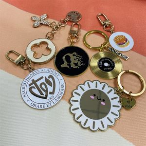 X48-1 China Manufacturer Logo Hotel <b>Keychains</b> Hard Enamel Black Nickel Plating Custom Alloy Fashion Motel Keychain Bag - Product Image 4