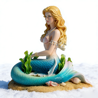 Sculpture de sirène en résine artistique, figurine de sirène assise sereine avec détails de coquillages et d'algues