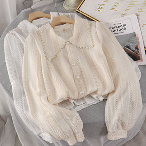 Chemise blanche <span class=keywords><strong>chic</strong></span> et élégante pour femme avec boutons perlés creux, col Peter Pan doux, chemise en crochet pour femmes - Product Image 1