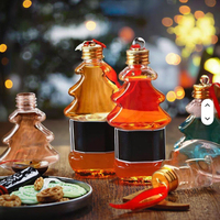 Vente en gros Bouteille PET transparente avec couvercle en argent pour jus et boissons énergisantes Décorations de Noël Utilisation suspendue