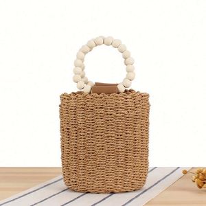 Sac fourre-tout de plage en paille tressée à la main pour femmes, avec perles en bois, style INS, simple et décontracté, sac seau rond - Product Image 1
