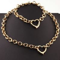 Ensemble collier et bracelet tendance en acier inoxydable plaqué or avec pendentif cœur ajouré pour femme - Vente en gros