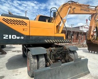 Excavatrice sur pneus Hyundai R210W d'occasion d'origine coréenne, 9 roues, bien entretenue, 21 tonnes, hydraulique
