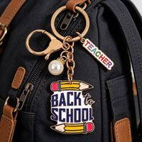 En gros Accessoires de rentrée scolaire pour étudiants et enfants : Breloque de sac et porte-clés en alliage avec pendentifs lettres, crayon, pomme