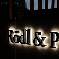 EZD Maßgefertigtes Schwarzes Metall Halo-Beleuchtetes Büro-Wandlogo Schild für Innen und Außen Firmen-Geschäftslogo Hintergrundbeleuchtete LED 3D-Buchstaben