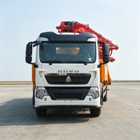 Camion pompe à béton HOWO TX 6X4 d'occasion, 10 pneus, flèche hydraulique en excellent état pour travaux de coulage quotidiens sur chantier