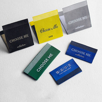 Étiquettes personnalisées noires tissées à extrémités pliées en tissu écologique pour vêtements, étiquettes d'entretien pour chemises et vestes