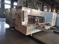 Machine automatique d'impression, de découpe et de rainurage pour la fabrication de cartons ondulés