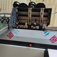 DQ404-2B Nouvelle machine à relier à double tête avec fonction de détection photoélectrique pour reliure à cheval plate et fabrication de livrets