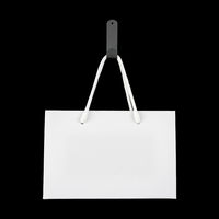Sacs fourre-tout en papier kraft blanc élégant avec poignées en corde robustes Emballage de luxe pliable pour magasins de vêtements Événements Revêtement brillant