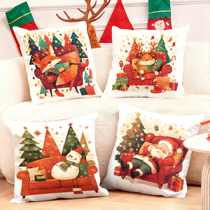크리스마스 장식 쿠션은 산타와 순록 등의 축제 캐릭터가 그려져 있어 소파에 앉아 있는 사람이 보이는데, 휴일 트리와 선물들이 함께 있어요. - Product Image 1