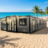 Maison conteneur extensible moderne de luxe de 40 pieds avec cadre noir et jaune désert, étanche et résistante au vent, pour usage hôtelier