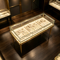 Vitrine de présentation de bijoux en métal doré antique avec pieds, comptoir en verre éclairé pour boutique de joaillerie haut de gamme