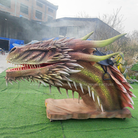 Statue réaliste de tête de dragon de machine de tour de dragons avec des mouvements adaptés aux besoins du client