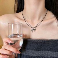 Nouveau Collier Sportif Femme 2026 en Acier Inoxydable avec Chaîne Bambou, Double Couche, Cordon Noir et Nœud Délicat Pailleté – Idéal pour Usage Quotidien