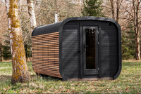 Runde Mobile Sauna-Kabine |   Verkohlte Holzverkleidung, Asphaltschindeldach & Holzofen-Schornstein |   Für 4-6 Personen geeignet