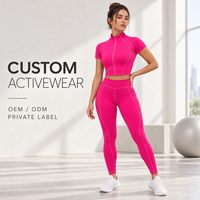 Ensemble de sport deux pièces pour femme : Crop top court à manches courtes entièrement zippé et legging de yoga taille haute avec détails de coutures