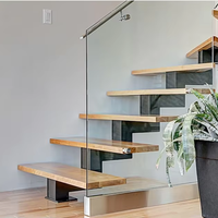 Escalier droit moderne haut de gamme avec marches en bois massif et poutres en acier pour projets résidentiels