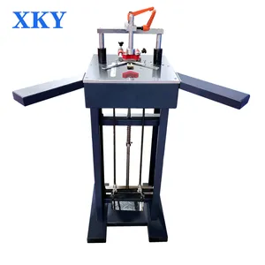 Manual foot stepping type photo frame making down pressing and nailing connection machine