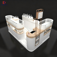 Kiosque de centre commercial incurvé effet marbre pour cosmétiques et parfums, avec poste de travail avec évier, cloison à lattes et enseigne de marque personnalisée pour la vente de produits de beauté
