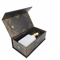 Étui rigide en carton noir obsidienne de luxe avec doublure en feuille d'aluminium pour l'emballage de whisky et de champagne haut de gamme