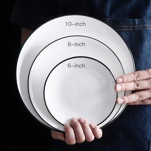 Platos de cena de cerámica con logotipo personalizado-Platos de porcelana blanca con borde negro para uso en comedor, fiesta y restaurante, disponibles a granel - Product Image 1